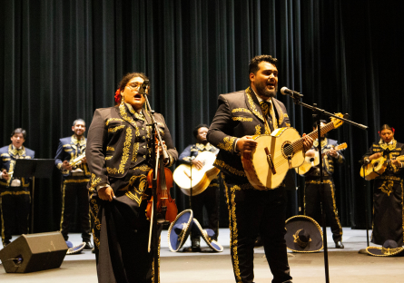 Mariachi ensemble members all take on the role of lead singer or back-up vocals