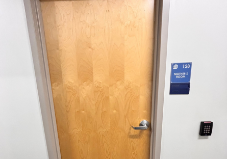 Image of Nursing Center Lactation Room door with blue sign next to the door with Phoenix College logo, the number 128, and the words "Mother's Room"