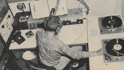 A student in Phoenix College's radio station in the 1950s with microphone, two turntables and other equipment