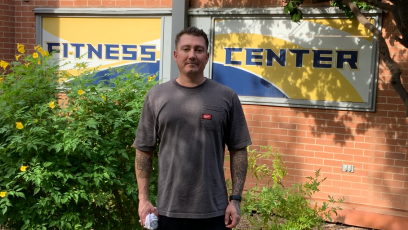 PC student and staff member Scott Eroe stands in front of the Fitness Center where he has been a member since 2016. 