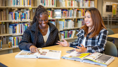 Two Phoenix College students discuss coursework in the Fannin Library