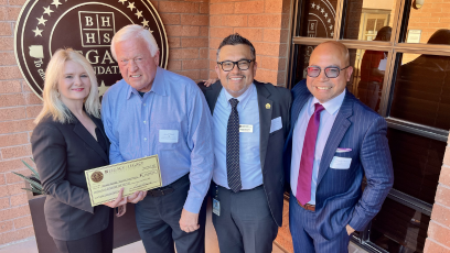 Phoenix College President Dr. Kimberly Britt accepts a check for $25,000 from Gerald Wissink, CEO of BHHS Legacy Foundation with Development Officer Alfredo Hernandez and Student Life and Leadership Director Aristotle Mosier