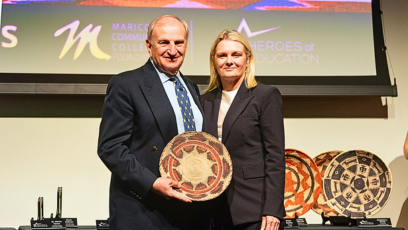 Peter Banko poses with PC President, Dr. Britt at Heroes of Education event