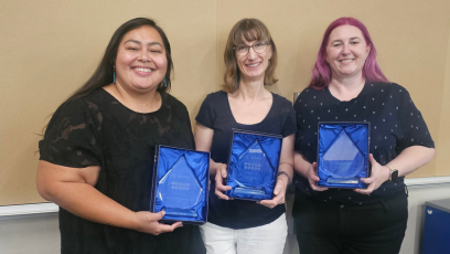 Three PC advisors hold up their awards at the recent MCCCD Academic Advisement conference