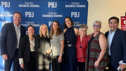 Dr. Kimberly Britt stands with Phoenix College staff and faculty at the Phoenix Business Journal Most Admired Leader reception celebrating her award