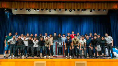Phoenix College's 2025 Men's Soccer team pose for a picture on the Bulpitt stage after the ceremony celebrating their historic national championship win