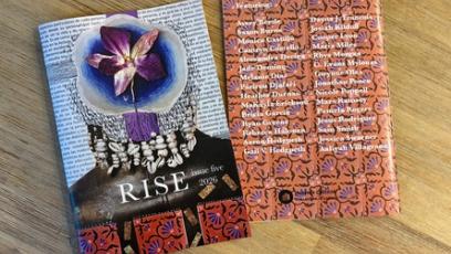copy of RISE on a table with the front and back cover being shown