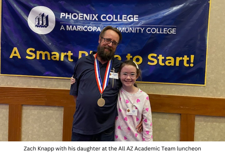 A PTK Academic All-star, Zach Knapp celebrates his many awards with his daughter. 