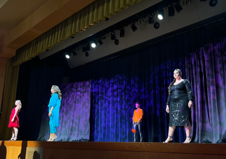 Four models walk Phoenix College's Bulpitt Auditorium stage during the fashion show Vie d'Ours Chique 