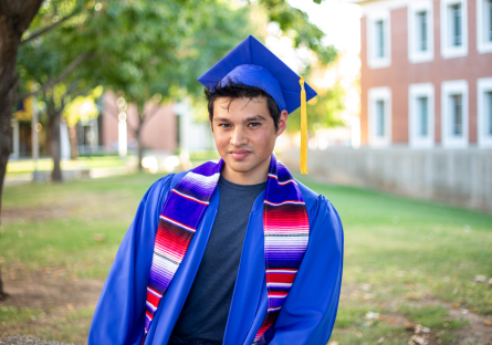 Phoenix College student Elian Jimenez in his grad cap, robe and stole
