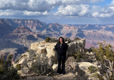 Phoenix College student Sahara Delaughter stands in front of the Grand Canyon.  