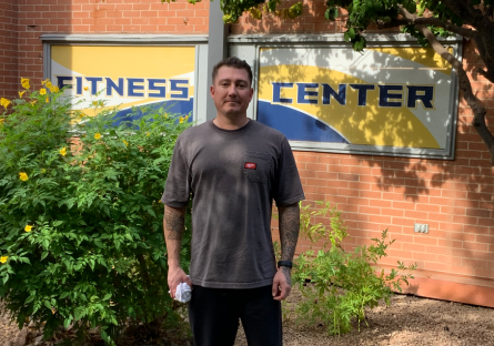 PC student and staff member Scott Eroe stands in front of the Fitness Center where he has been a member since 2016. 