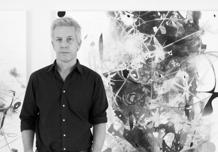 Matthew Ritiche stands in front of one of his painting; he is this year's guest artists in Phoenix College's Eric Fischl Series