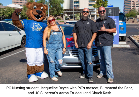 Phoenix College Nursing student Jacquelina Reyes stands next to PC Mascot Bumbstead the Bear and Aaron Trudeau and Chuck Rash of JC Supercars