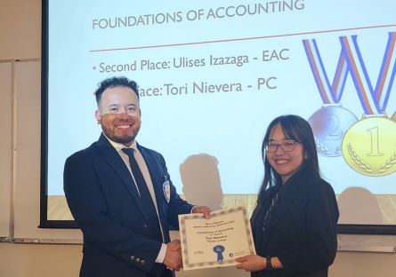 Phoenix College student and member of Future Business Leaders of America, Tori Nievera, accepts her first place award for Accounting