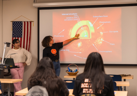 Looking into the Sun worskhops was part of the Hermanas Conference at Phoenix College. Here, student look at a slide of the different layers of the sun. 