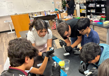 college student working with middle school students