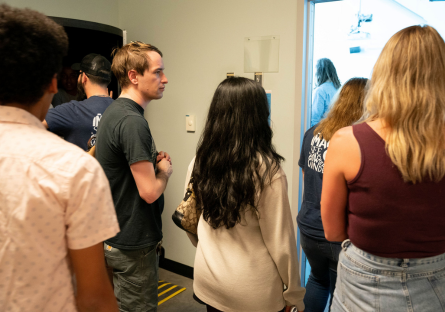 Phoenix College student Cooper Lyon among his Psych101 peers on a campus tour with their pen pals. 