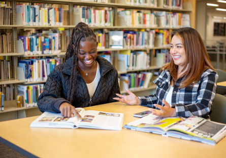 Two Phoenix College students discuss coursework in the Fannin Library