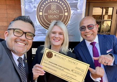 Phoenix College President Dr. Kimberly Britt accepts a check for $25,000 from of BHHS Legacy Foundation with Development Officer Alfredo Hernandez and Student Life and Leadership Director Aristotle Mosier