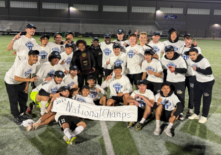 Phoenix College Men's Soccer poses on the pitch after winning the national championship