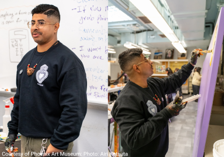 Edgar Fernandez teaching the work of mural making at Maryvale High School