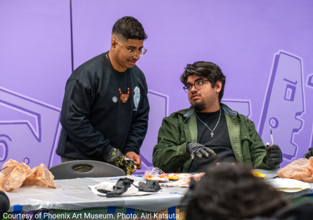 Edgar Fernandez working with a student during his residency at Maryvale High School