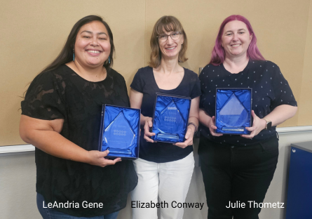 Three PC advisors hold up their awards at the recent MCCCD Academic Advisement conference