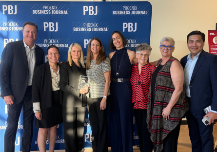 Dr. Kimberly Britt stands with Phoenix College staff and faculty at the Phoenix Business Journal Most Admired Leader reception celebrating her award
