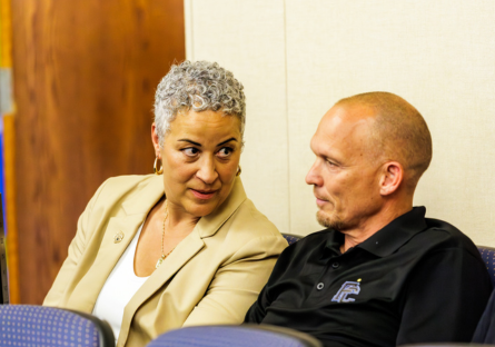 Phoenix College Athletic Director Kristine Kincaid with Men's Soccer Head Coach Dave Cameron inside Bulpitt Auditorium 