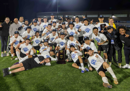 Phoenix College's 2025 Men's Soccer team pose for a pictures on the pitch after their history national championship win