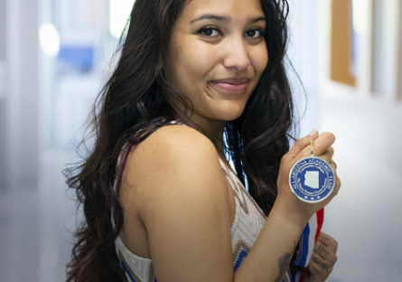 Pocahontas Daniels with her All-Arizona Award Medal