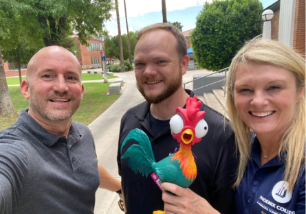 PC Administration posing with Hei Hei rubber chicken