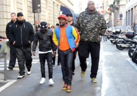 Floyd Mayweather's security team walking down the street in a city
