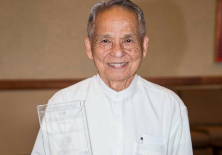 Dr Myint receiving award