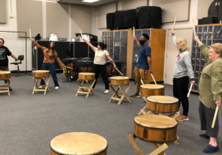 Phoenix College painting students participating in an interdisciplinary workshop incorporating Taiko drumming, mindfulness, and painting