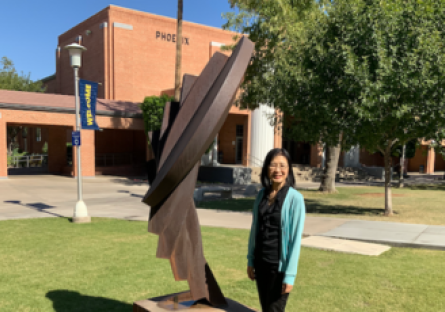 Ayumi Sasaki stands in the courtyard outside the Phoenix College Library where she attends English Conversation Circles after her English as a Second Language (ESL) class. 