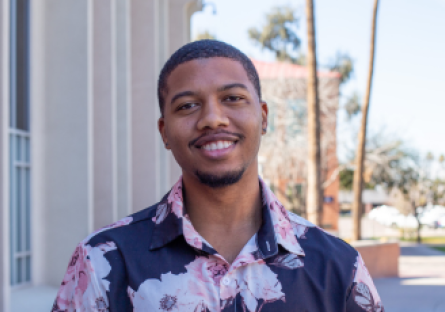 Phoenix College student and Black Student Union President Javyn Booth stands outside the Library on campus 