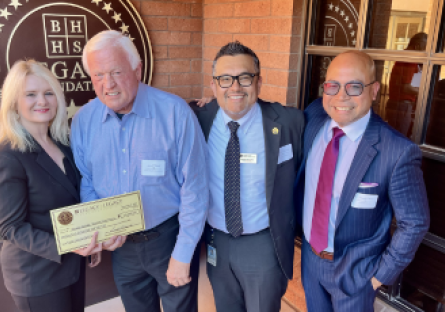 Phoenix College President Dr. Kimberly Britt accepts a check for $25,000 from Gerald Wissink, CEO of BHHS Legacy Foundation with Development Officer Alfredo Hernandez and Student Life and Leadership Director Aristotle Mosier