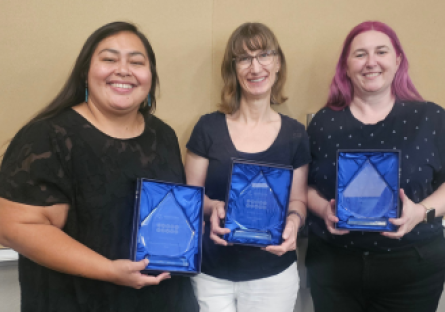 Three PC advisors hold up their awards at the recent MCCCD Academic Advisement conference