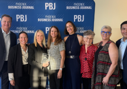 Dr. Kimberly Britt stands with Phoenix College staff and faculty at the Phoenix Business Journal Most Admired Leader reception celebrating her award
