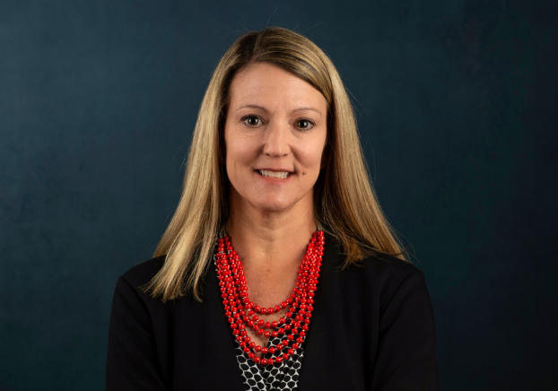 Dr. Heather Kruse headshot on grey background